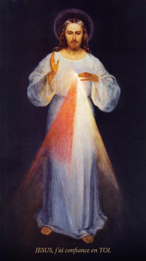 tableau de la divine misericorde représentant Jésus. De sa main droite partent des rayons rouges et pâles